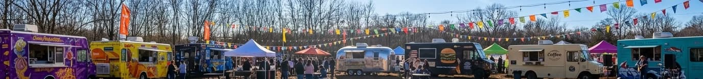 Panorama of food trucks, vendor tents, and crowds at Mines Market